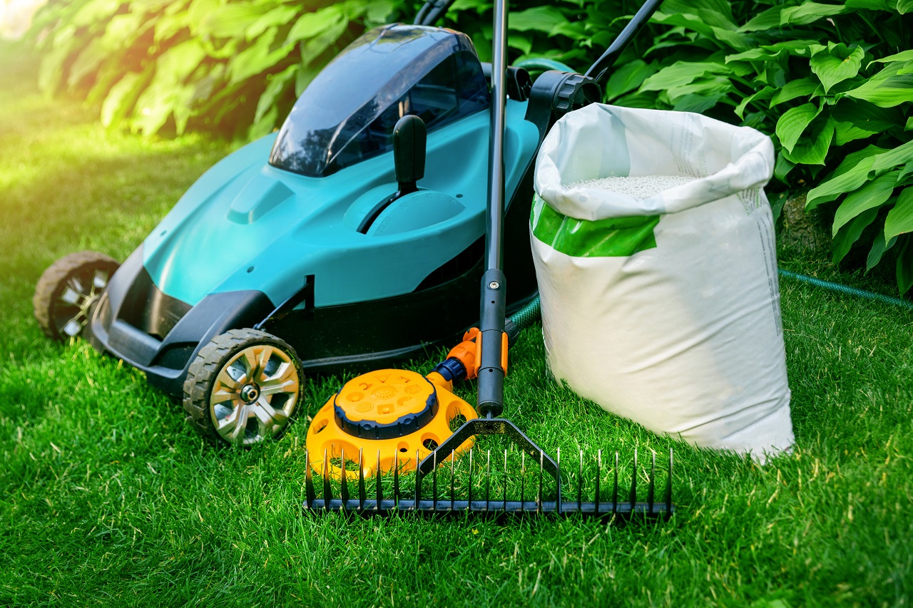 gardening-tools-and-lawn-care-equipment-on-green-grass